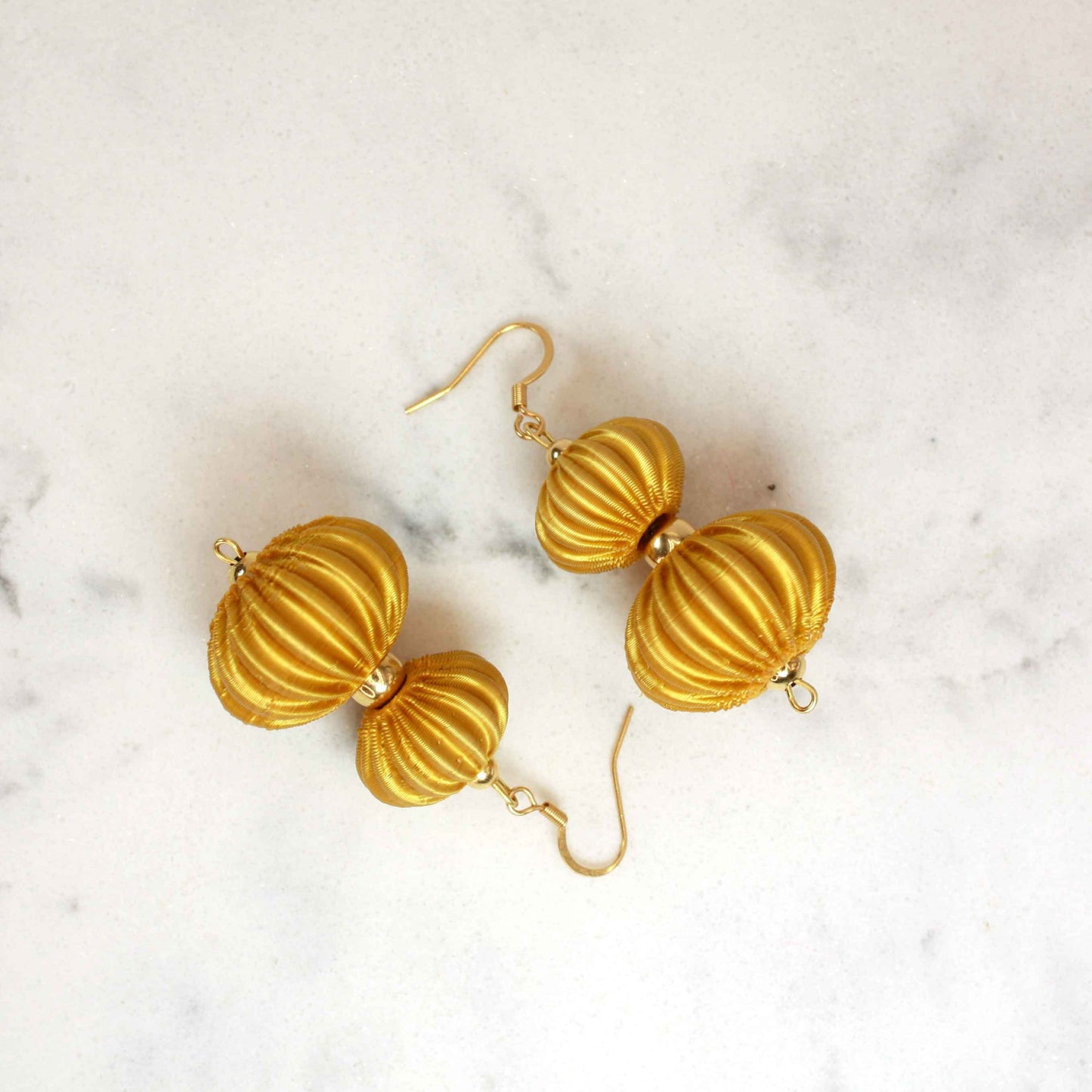 Boletia earrings from the Lukt collection, in gold, 3D printed, very light and sophisticated.