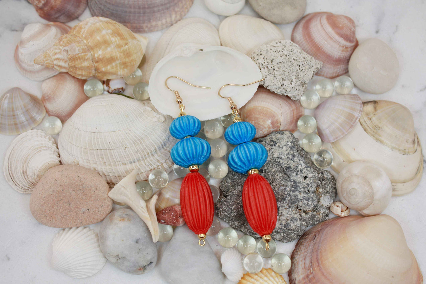 Anemone earrings from the Lukt collection, in Cyan and Coral, 3D printed, very light and sophisticated.