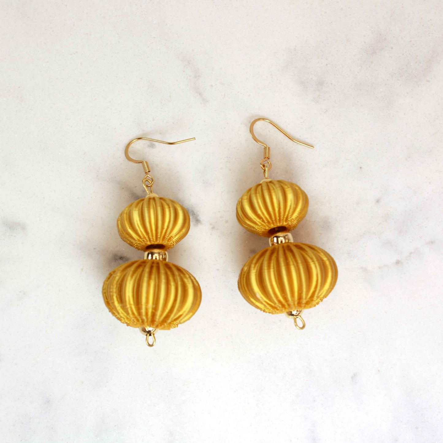 Boletia earrings from the Lukt collection, in gold, 3D printed, very light and sophisticated.