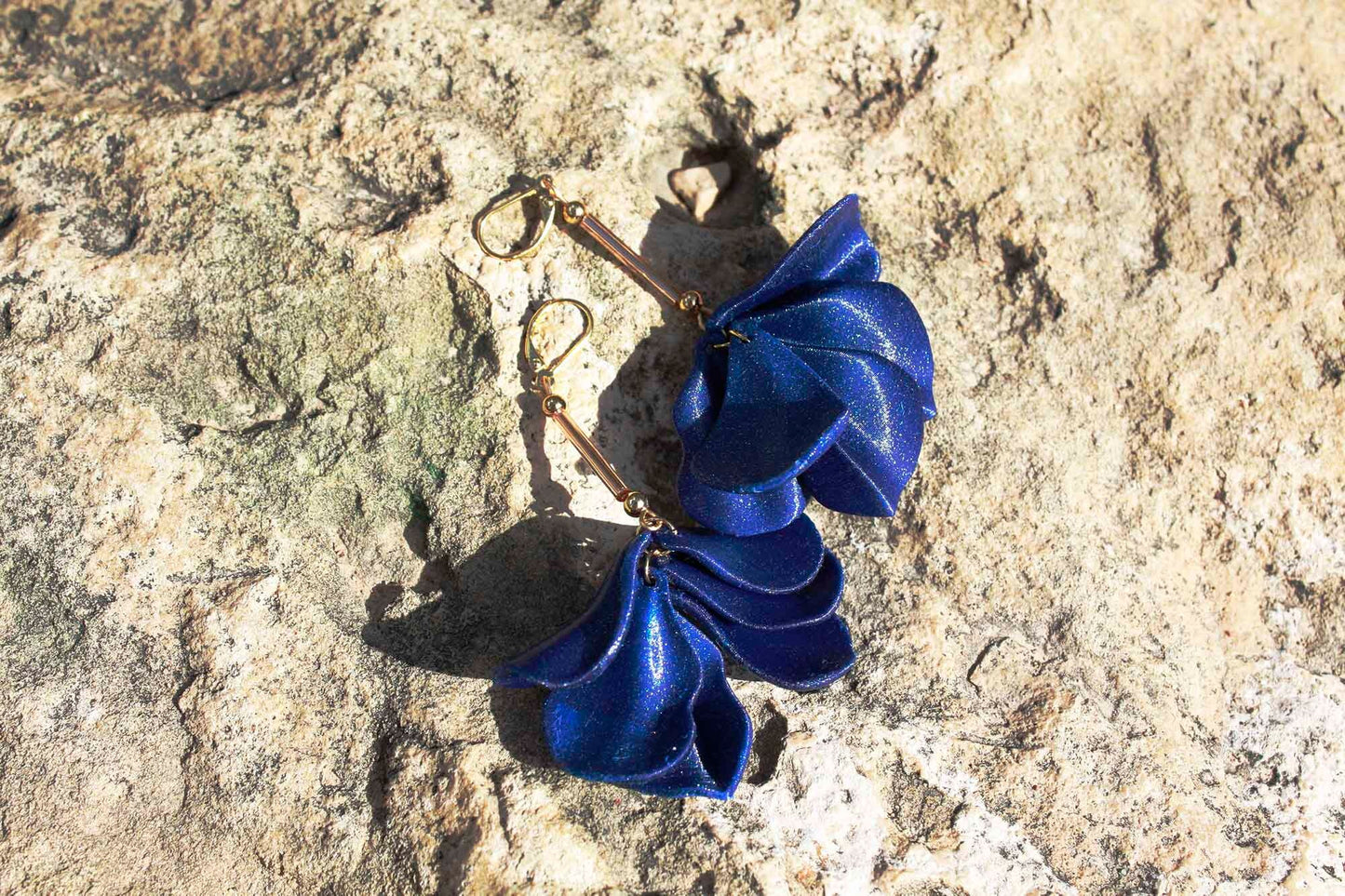 Malvace earrings in Ultramarine Blue. 3D printed in PLA with a glitter effect.
