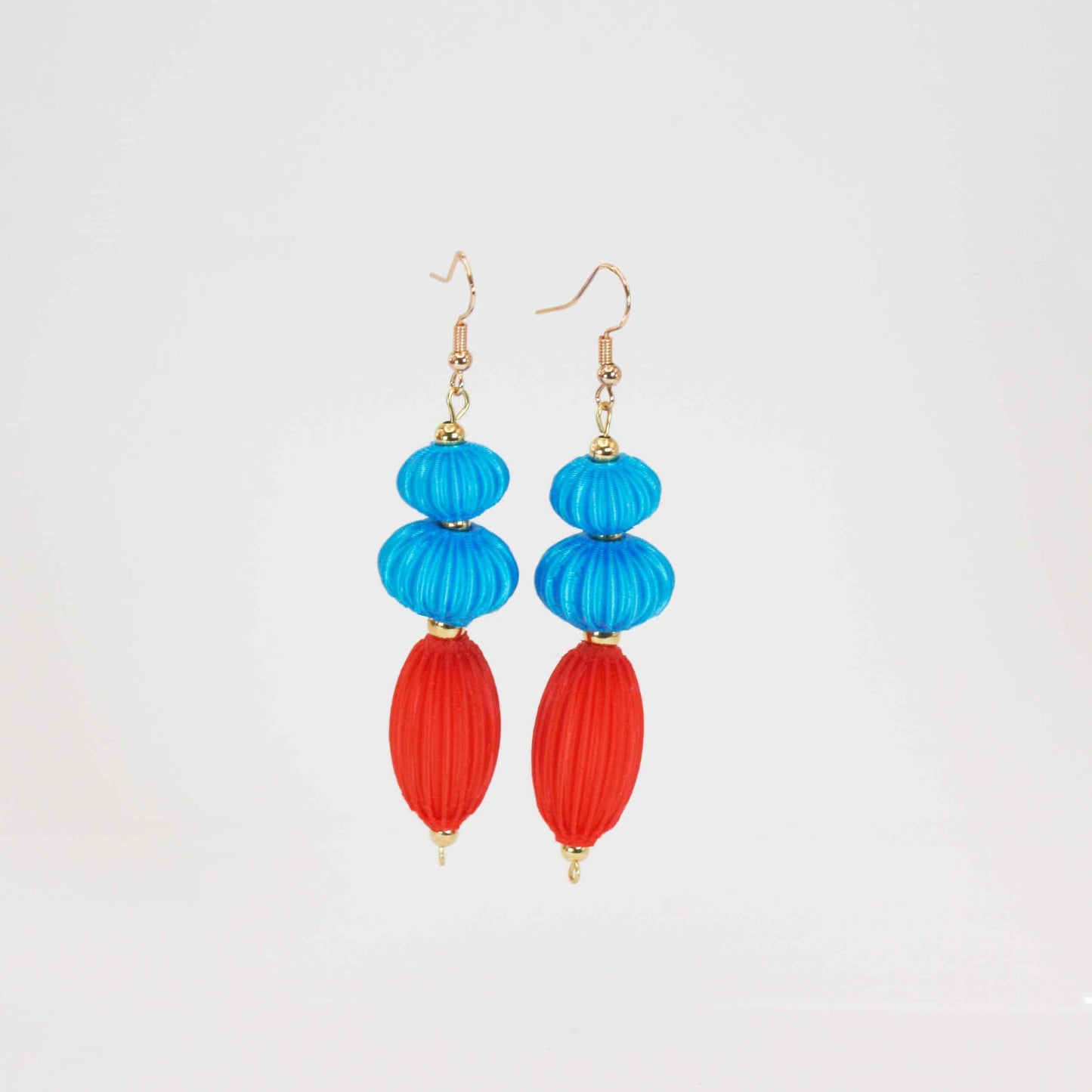 Anemone earrings from the Lukt collection, in Cyan and Coral, 3D printed, very light and sophisticated.