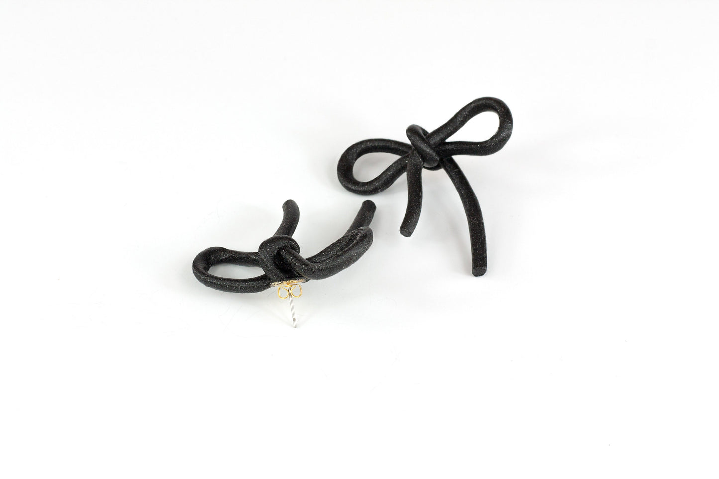 Black bow earrings with snap closure. Coquette Collection.
