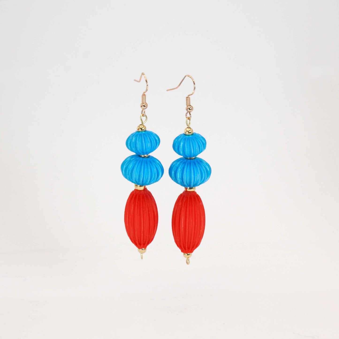 Anemone earrings from the Lukt collection, in Cyan and Coral, 3D printed, very light and sophisticated.