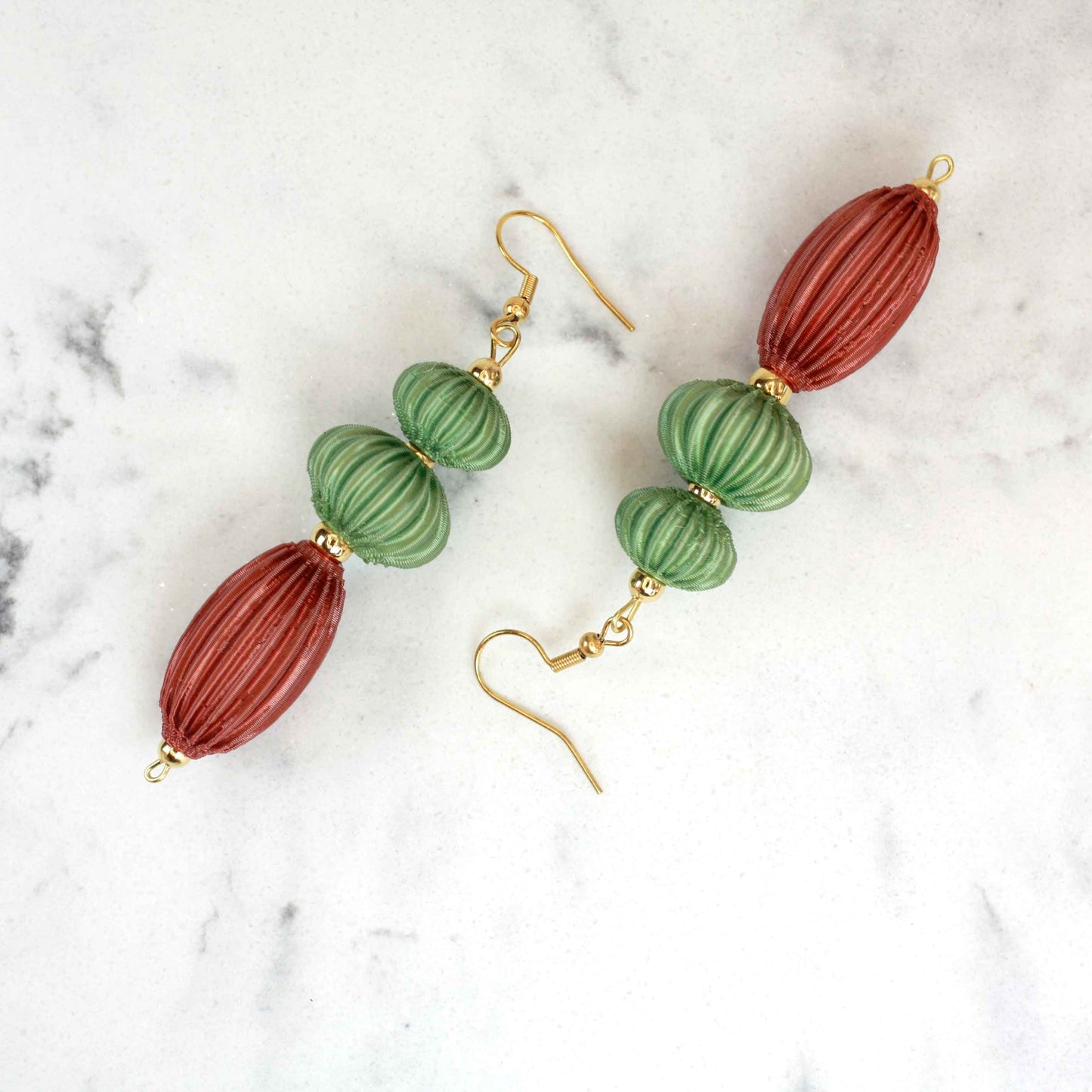 Anemone earrings from the Lukt collection, in Leaf and Cooper Green, 3D printed, very light and sophisticated.