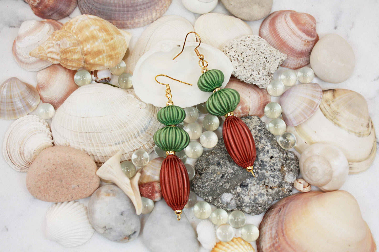 Anemone earrings from the Lukt collection, in Leaf and Cooper Green, 3D printed, very light and sophisticated.