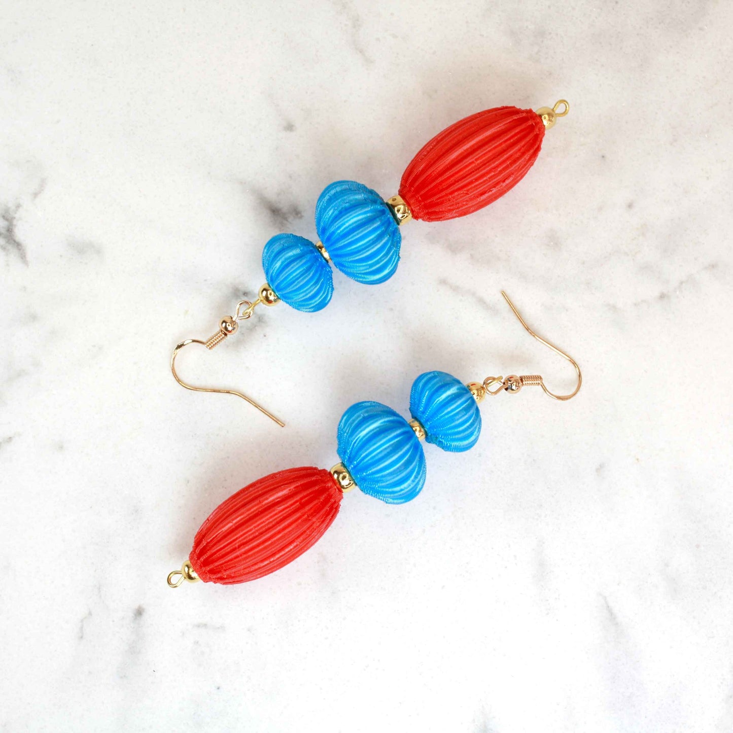 Anemone earrings from the Lukt collection, in Cyan and Coral, 3D printed, very light and sophisticated.