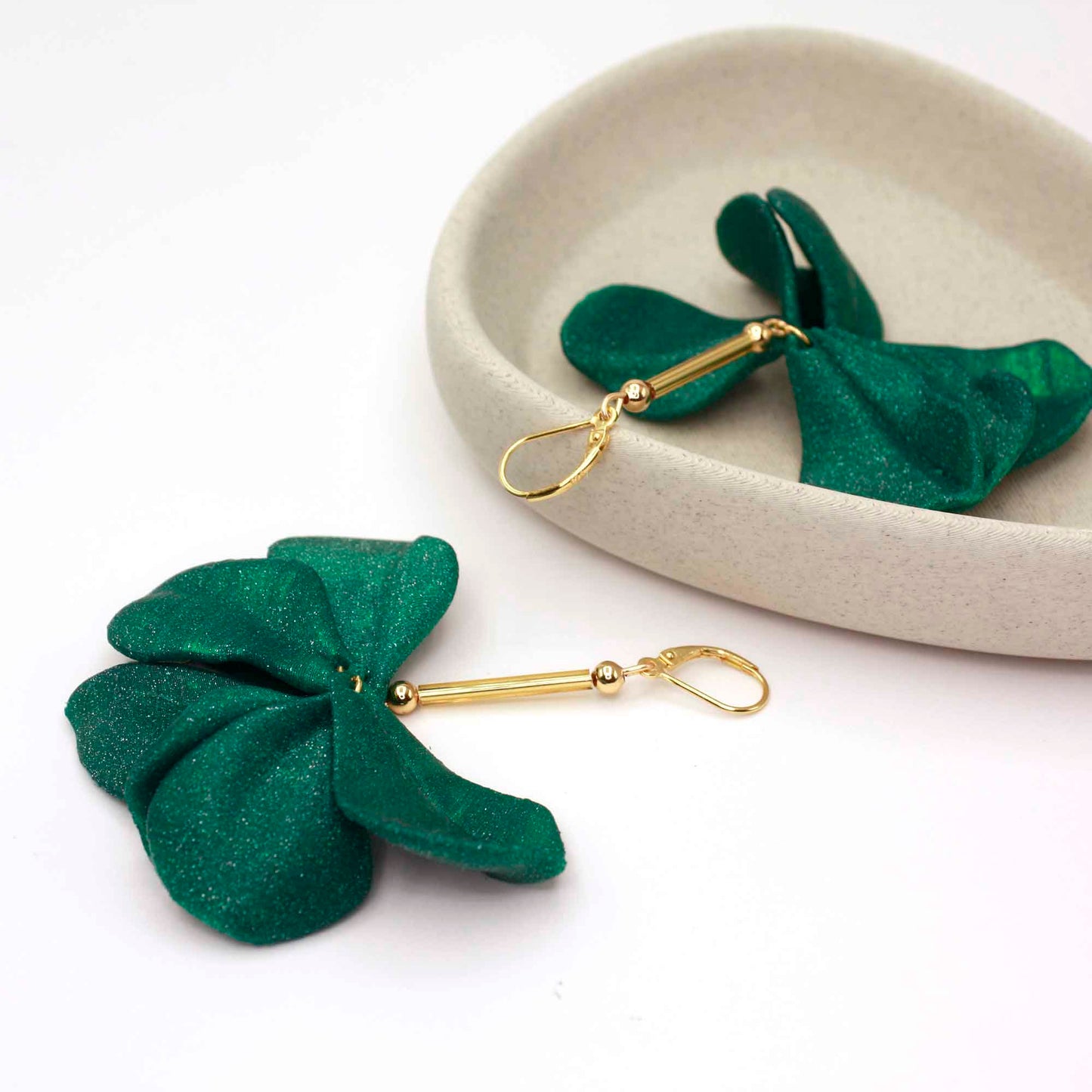 Emerald-colored Malvace earrings. 3D printed in glitter-effect PLA.