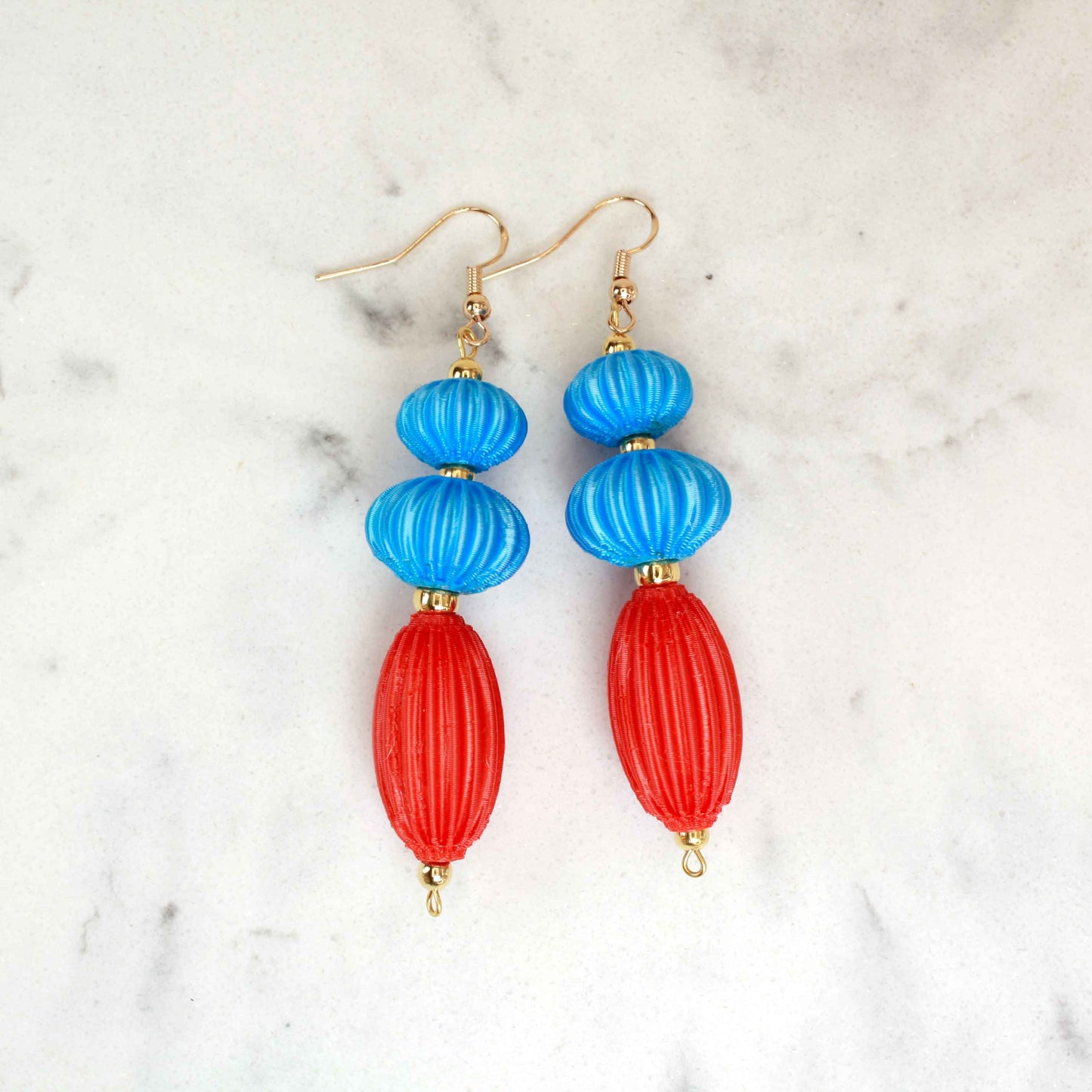 Anemone earrings from the Lukt collection, in Cyan and Coral, 3D printed, very light and sophisticated.