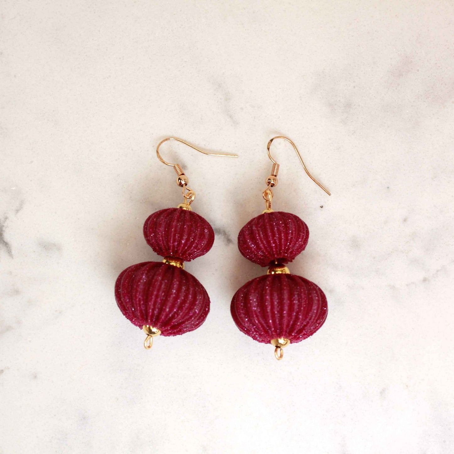 Boletia earrings from the Lukt collection, in Bordeaux, 3D printed, elegant and lightweight.