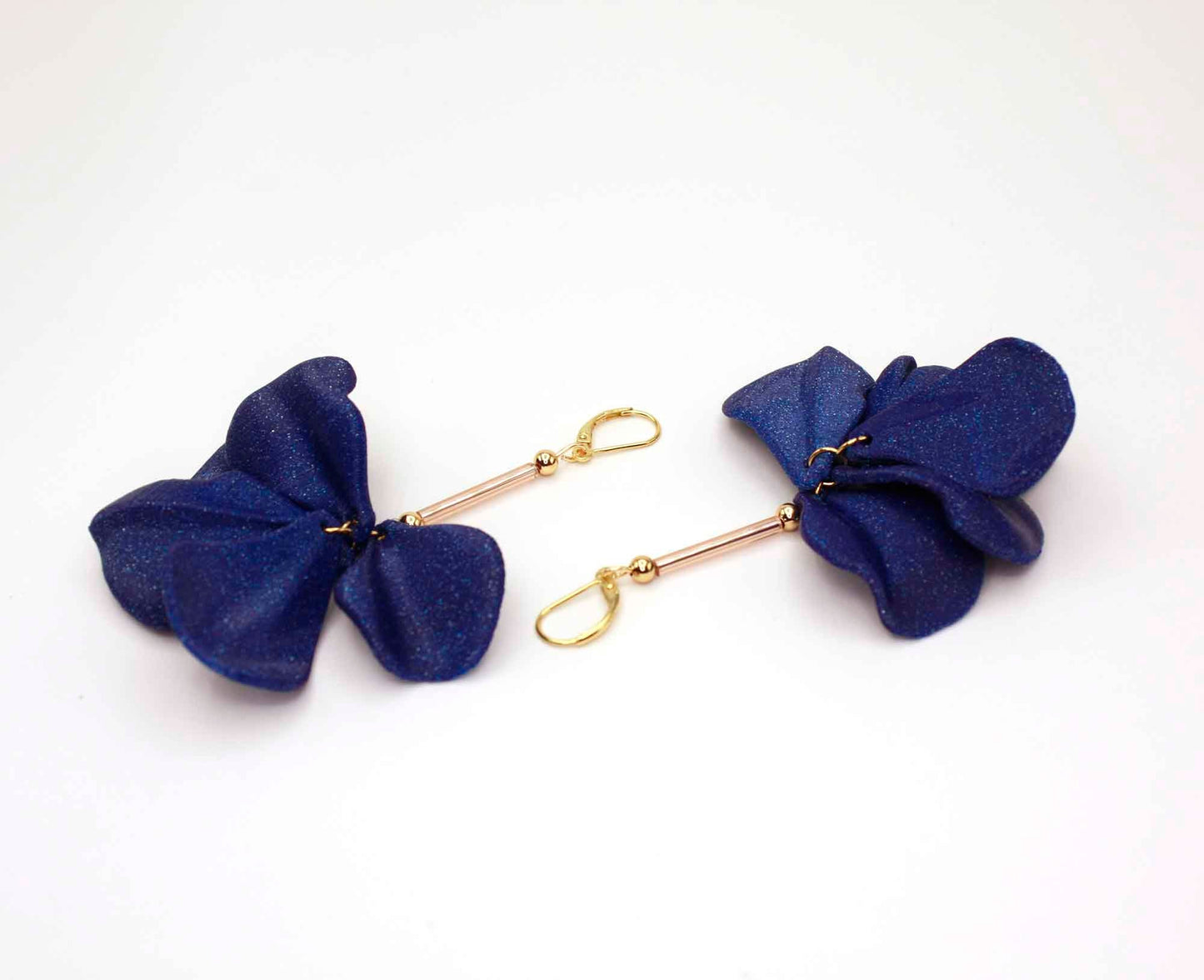 Malvace earrings in Ultramarine Blue. 3D printed in PLA with a glitter effect.
