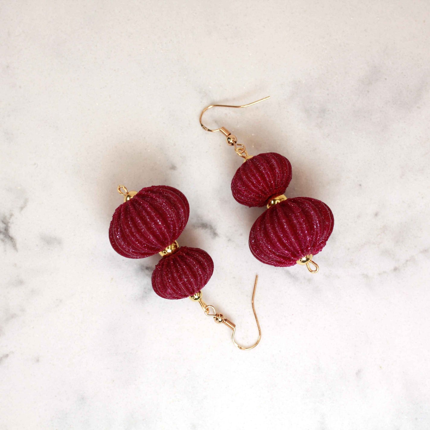 Boletia earrings from the Lukt collection, in Bordeaux, 3D printed, elegant and lightweight.