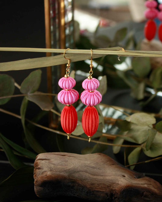 Anemone earrings from the Lukt collection, in vibrant pink and coral red, 3D printed, very light and sophisticated.