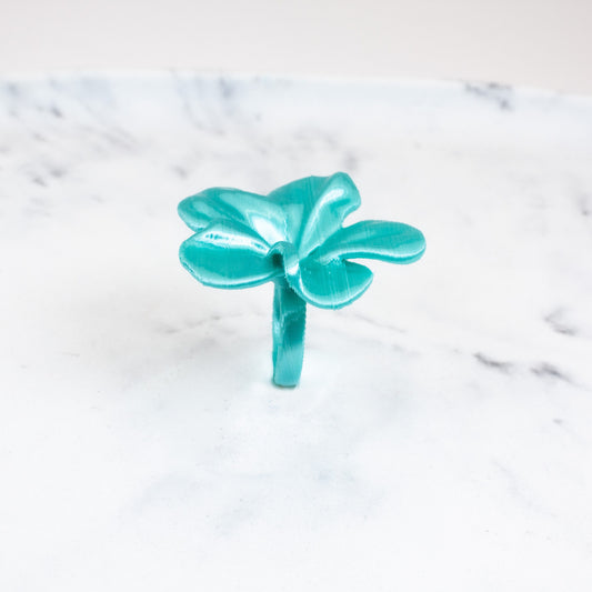 Custom-made 3D printed turquoise Hibis flower ring, available in various colors.
