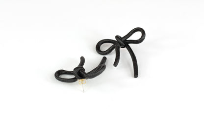 Black bow earrings with snap closure. Coquette Collection.